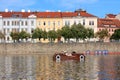Pedal boat car with young woman on the river Vltava in centre of Prague