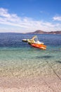 Pedal boats and kayak in the clear water of Padulella beach, Island of Elba, Italy