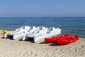 Pedal boats and kayaks for rent on sandy beach