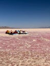 Pedal boats in the middle of salt lake in Iran. Swan pedal boat. Salt desert. Royalty Free Stock Photo