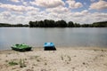Pedalos, or paddle boats, on the shore of the Danube River, in Romania, on a sandy beach Royalty Free Stock Photo