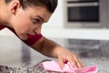 Pedantic woman cleaning kitchen