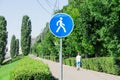 Pedestrian area. Road sign. Embankment in Saratov, Russia. Lonely pedestrian in shorts