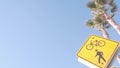 Pedestrian bike crossing yellow road sign, California USA. Ped and bicycle xing. Royalty Free Stock Photo