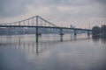 Pedestrian bridge with a bike path across the Dnieper River in the center of Kyiv