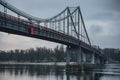 Pedestrian bridge with a bike path across the Dnieper River in the center of Kyiv