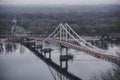 Pedestrian bridge with a bike path across the Dnieper River in the center of Kyiv