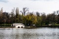 Pedestrian bridge in Bordei park over the lake. Bucharest, Romania