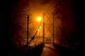 Pedestrian bridge in dense fog at night Royalty Free Stock Photo