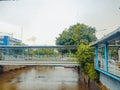 pedestrian bridge over the Ciliwung river Royalty Free Stock Photo