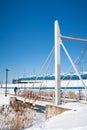 Pedestrian bridge over a frozen river, locks on the railing, signs of loyalty of newlyweds, relationships