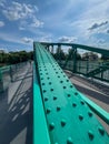 A pedestrian bridge over the Oder River in Opole, Poland, constructed using riveted technology Royalty Free Stock Photo