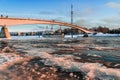 Pedestrian bridge over the Volkhov River. Winter view of a frozen river. Veliky Novgorod.