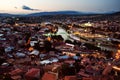 Pedestrian Bridge of Peace and old building roofs, Tbilisi at sunset