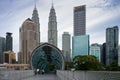 Pedestrian bridge Pintasan Saloma with Petronas Towers in background, Kuala Lumpur, Malaysia Royalty Free Stock Photo