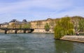 Pedestrian bridge Pont des Arts over Seine river and historic buildings of Paris France Royalty Free Stock Photo