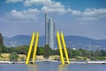 Pedestrian bridge and skyscraper on Danube river