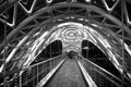 Pedestrian bridge. Steel glass construction illuminated numerous lights. Architecture concept. Bridge in Tbilisi. Curvy