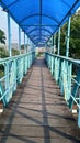 a pedestrian bridge with wooden steps with a blue at jendral sudirman street, Semarang, Central Java, Indonesia