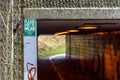 Pedestrian and ciclyst path under road with a label saying - Please don`t be mean. Let`s keep our streets clean