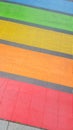 Pedestrian colors crossing marking in LGBT colorful rainbow lesbian gay flag in Bordeaux France