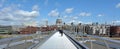 Pedestrian cross over the Millennium Bridge in London, UK Royalty Free Stock Photo