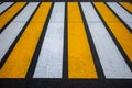 Pedestrian crossing on an asphalt road in the rays of the setting sun Royalty Free Stock Photo