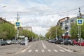 Pedestrian crossing at the beginning of the Paris Commune street in Krasnoyarsk city on a spring day Royalty Free Stock Photo