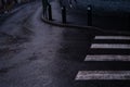 pedestrian crossing in dark colors in rainy weather Royalty Free Stock Photo