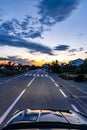 Pedestrian crossing in the evening, seen from oncoming car, driving too fast Royalty Free Stock Photo