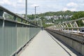 Pedestrian crossing on a highway bridge over a river in West Germany, you can see a man walking. Royalty Free Stock Photo