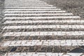 Pedestrian crossing on the old pavement. Street paving. Cobblestone pavement Royalty Free Stock Photo