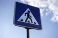 Pedestrian crossing road sign on a sky background