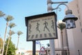 Pedestrian crossing sign with arabic and english letters