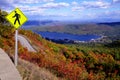 Pedestrian Crossing Sign at Top of Autumn Mountain with Lake Royalty Free Stock Photo