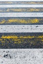 Pedestrian crossing, yellow and white stripes on wet asphalt in the form of texture and substrate Royalty Free Stock Photo