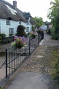 Pedestrian footbridge over a stream on the edge of a Devon village Royalty Free Stock Photo