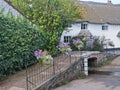 Pedestrian footbridge over a stream on entering the village Royalty Free Stock Photo