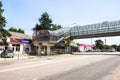 Pedestrian overpass over road in Akhtyrka village Royalty Free Stock Photo