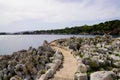 Pedestrian path by mediterranean sea on the tourist coast Juan-les-Pins in Antibes France