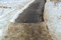 pedestrian path partially cleared of ice and snow Royalty Free Stock Photo