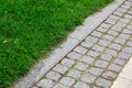A pedestrian pavement made of stone cobble and granite tiles. Royalty Free Stock Photo
