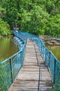 Pedestrian pontoon bridge across small river