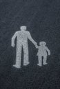 Pedestrian sign on asphalt, child care and family concept Royalty Free Stock Photo