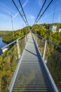 Pedestrian suspension bridge above Rappbodetalsperre lake and Rappbode River in Harz Mountains National Park, Germany