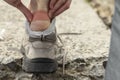 A pedestrian tourist glues a patch on his foot.