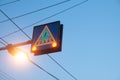 Pedestrian traffic sign with glowing green light and save to move against blue sky Royalty Free Stock Photo