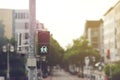 pedestrian traffic light showing a green graphic of loving same sex lesbian women couple in a sunny inner city surrounding Royalty Free Stock Photo