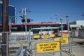 Pedestrian transit train crossing with warning lights with transit train Royalty Free Stock Photo