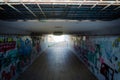 Pedestrian underpass tunnel with painted of graffiti on the wall Royalty Free Stock Photo